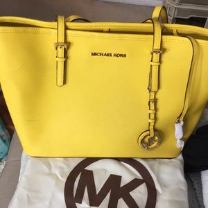 Bright yellow small/medium size Michael Kors bag